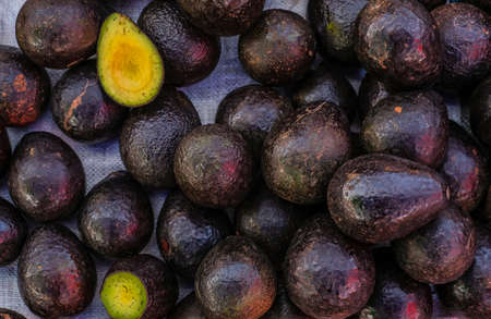 Fresh tropical avocado fruit close up display for sell at the market, good for backgroundの写真素材