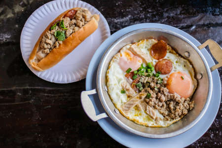 Indochina pan-fried egg with pork and toppings, Breakfast food in Thai style,vietnamese fried eggs and vietnamese sandwich Banh Meの写真素材