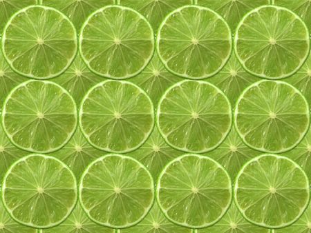 fresh cut green lime on a plain background