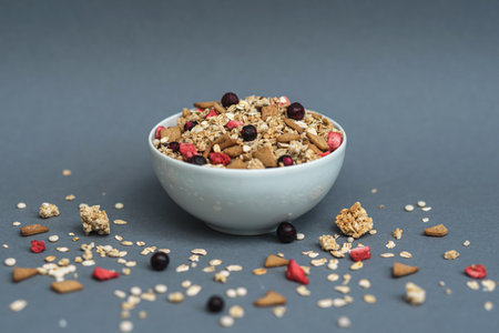 A bowl of muesli on a gray monochrome background, healthy food, healthy breakfastの写真素材