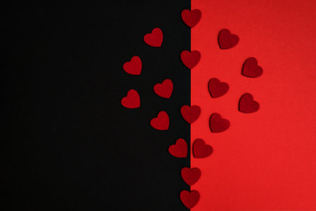 Black and red background decorated with red hearts, a banner for discounts or congratulationsの写真素材