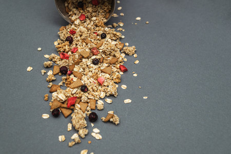 Baked fruit muesli scattered on the table. homemade granola. side viewの写真素材