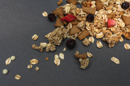Baked fruit muesli scattered on the table. homemade granola. side viewの写真素材