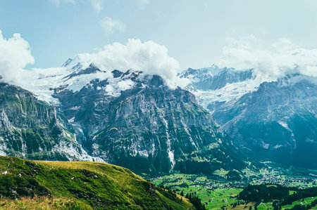 Summer mountain landscape with green grass and mountain peaks.の写真素材