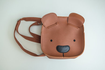 Children's backpack on a white background. Isolated teddy bear backpack on a white backgroundの写真素材