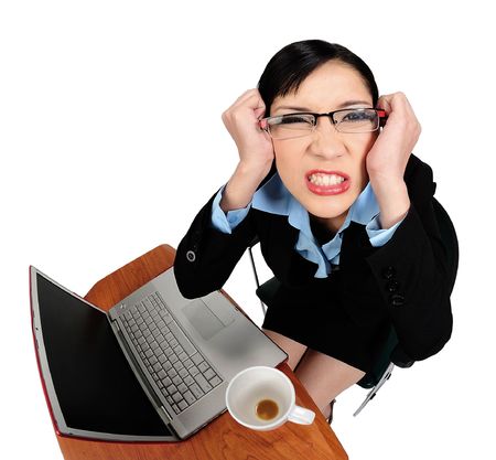 Young asian woman angry with her computerの写真素材