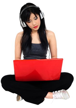Very seductive young  asian woman listening music from the computerの写真素材