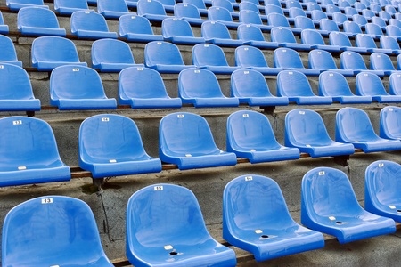 Blue plastic seats at the stadium with numbering