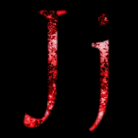 grunge font letter j on a black backgroundの写真素材