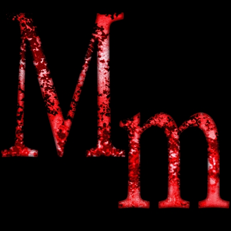grunge font letter m on a black backgroundの写真素材