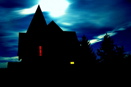 Halloween house against a cloudy sky Moon