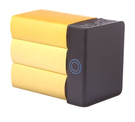 Row of yellow hardback books with a computer hard drive