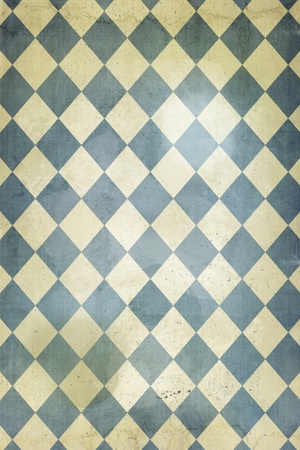 Faded and distrssed wallpaper with a harlequin patternの写真素材