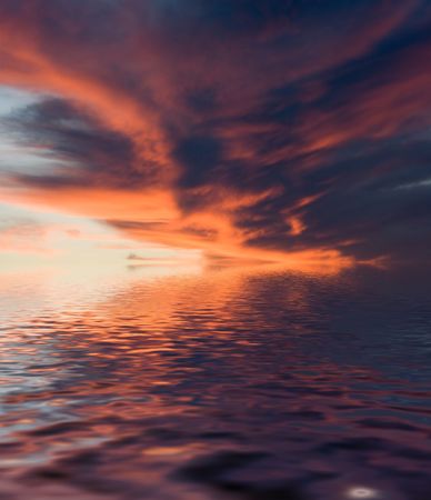 Red evening clouds with reflectionの写真素材