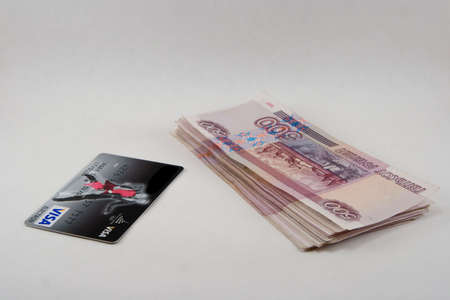 Pile of monetary denominations on a white backgroundの写真素材