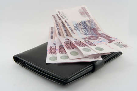 Money in a purse on a white backgroundの写真素材