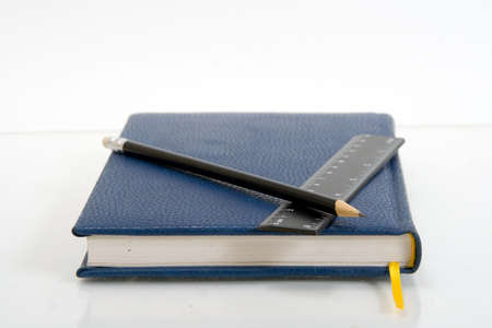 Dark blue notebook on a table. Close up.の写真素材