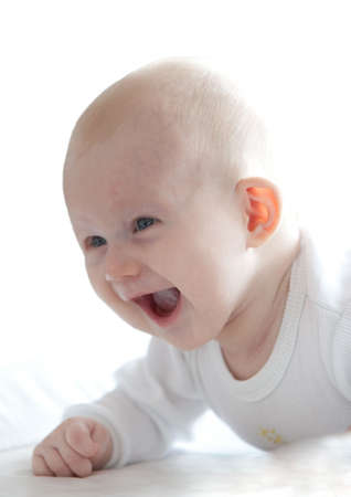 Portrait of the small baby on white backgroundの写真素材