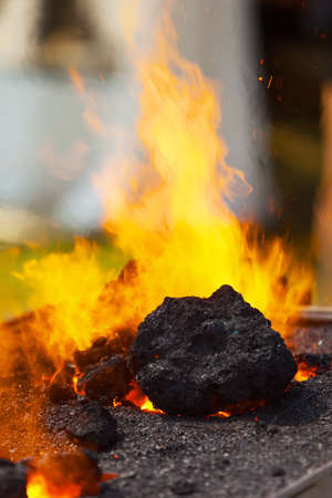 Burning of coal in smithy
