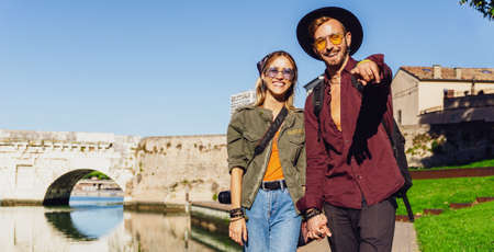 Couple or friends laughing funny and having fun with a smart phone