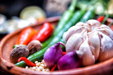 Spices to make food more delicious, shallots, garlic, red chilies, green chilies, candlenut, coriander, salt, and nutmegの写真素材