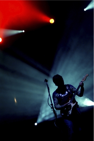 Rock star guitarist solo on stage at a concertの写真素材