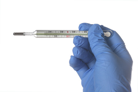 Hand in a blue glove holding a mercury thermometer isolated on white, shallow focus