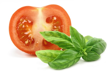 Tomato and basil isolated on white backgroundの写真素材