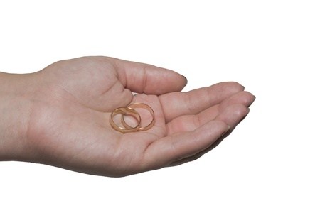 The female hand holds two ringsの写真素材