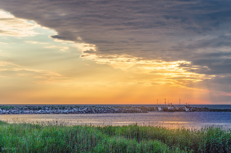 The sunrise in the Ladoga lake. The Ladoga lake is one of the biggest in Russia. It is located near Saint-Petersburg.の写真素材
