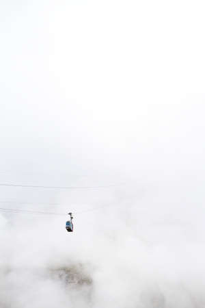 Fuente De, Cantabria/Spain; Aug. 04, 2015. A cable car in the fog.のeditorial素材