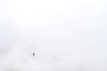 Fuente De, Cantabria/Spain; Aug. 04, 2015. A cable car in the fog.