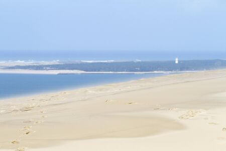 The Dune of Pilat is the tallest sand dune in Europe. It is located in La Teste-de-Buch in the Arcachon Bay area, France, 60 km from Bordeaux. With more than one million visitors per year, the Dune of Pilat is a famous tourist destination.の写真素材