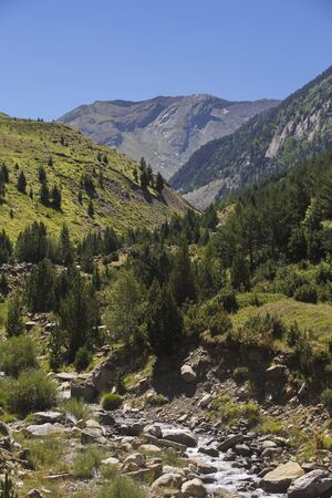 Cerler, Huesca/Spain; Aug. 21, 2017. Hiking along the route of the three waterfalls of Ardones in the town of Cerler in the summer holidays.の写真素材