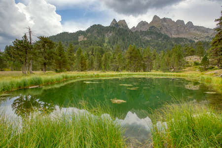 Benasque, Huesca/Spain; Aug. 22, 2017. The Posets-Maladeta Natural Park is a Spanish protected natural space.Reflections in the Ibonet de Bastisielles.のeditorial素材