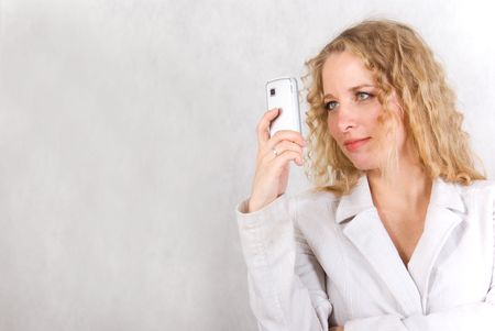 The girl speaks on a cellular telephone. の写真素材