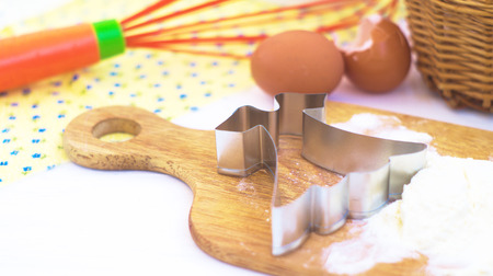               dress cookie cutter is lying on the table with flour                 の写真素材