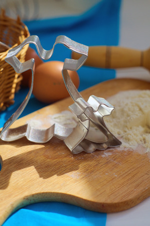                            Big and small cutters shaped as a dress are standing on the deskの写真素材