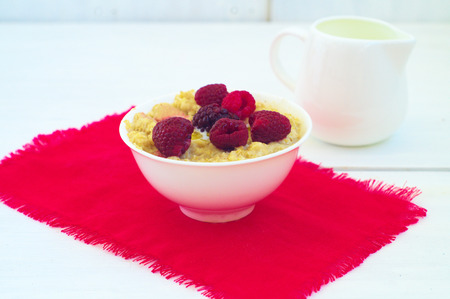                          Porrige and berries in the white plate      の写真素材