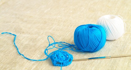              Two  balls of yarn with crochet hook                     の写真素材