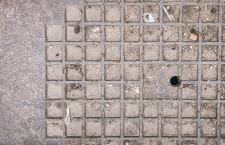 Dirty sewer hatch cover iron metal texture background, flat lay, close up photo.の写真素材