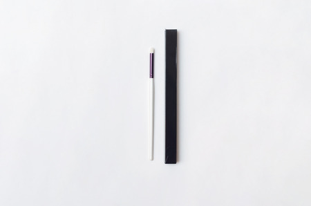 New make up brush in the black box isolated on white background.の写真素材