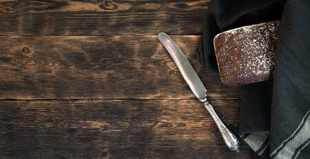 Freshly baked bread on a wooden table background with copy space.の写真素材