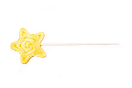 Yellow star shape candy isolated white background.の写真素材
