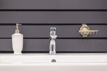 Sink, faucet and soup bottle abstract background.の写真素材