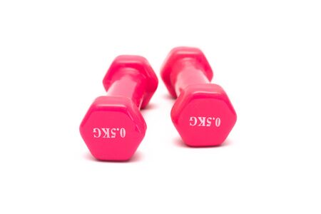 Two pink dumbbells isolated on white background.の写真素材