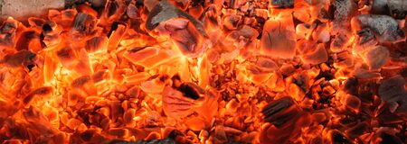 Burning coals textured background.