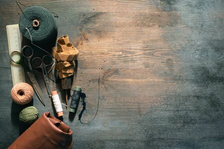 Old sewing accessory flat lay background.