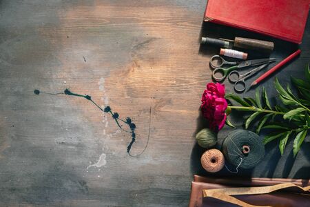 Old sewing accessory flat lay background.