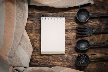 Food menu or product list mock up. Blank pages notepad on a wooden kitchen table background.の写真素材